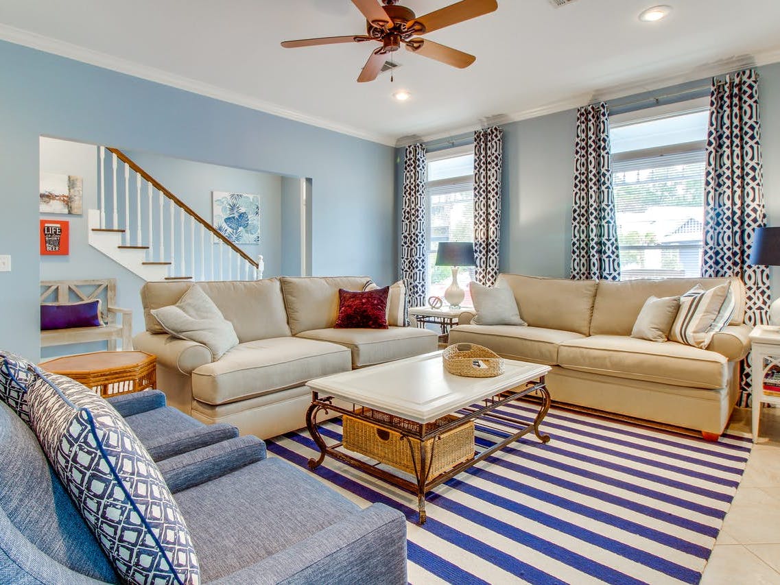 Living room of vacation rental decorated in blue hues located in Florida